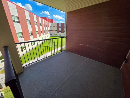 Private balcony featuring durable outdoor carpeting and a protective railing - 319 5816 Mullen Place, Edmonton, AB 