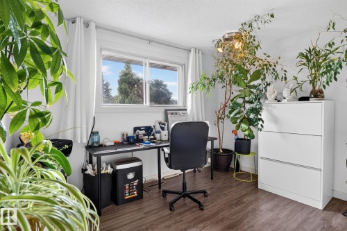 White walls with wood-finish flooring - 7539 149A Avenue, Edmonton, AB 