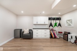 Recessed lighting illuminates wood-finish flooring - 