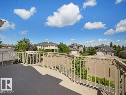 Expansive outdoor balcony featuring a decorative metal railing and a durable surface - 2423 Tegler Green, Edmonton, AB 