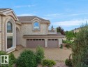 Stone veneer exterior with arched window accents - 2423 Tegler Green, Edmonton, AB 