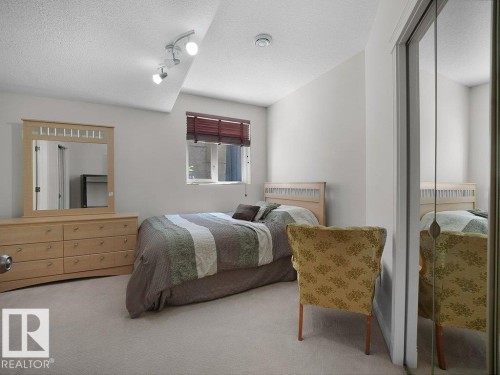Bedroom featuring light-colored carpeting and white painted walls - 2423 Tegler Green, Edmonton, AB 