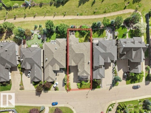 Aerial view showcasing the property's roofline, surrounding green space, and neighboring residences - 2423 Tegler Green, Edmonton, AB 