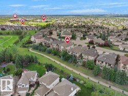 Aerial representation of a residential area featuring multiple detached properties with pitched roofs and established landscaping - 