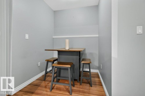 Compact dining area with wood-finish flooring - 11330 101 Street, Edmonton, AB 
