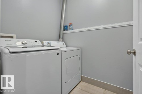 Dedicated laundry area featuring a washer and dryer set - 11330 101 Street, Edmonton, AB 