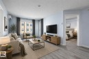 Open-concept living area featuring wood-finish flooring, light blue wall tones, and a large window - 403 25 Element Dr, St. Albert, AB  - Indoor Photo Showing Living Room 