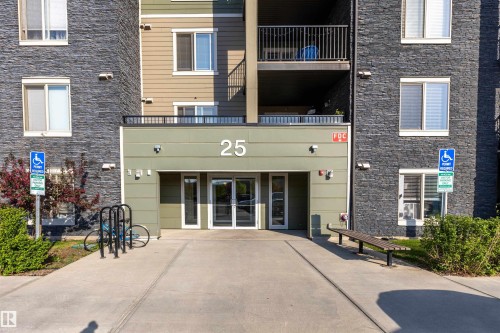 Building exterior featuring a stone facade and siding accents - 403 25 Element Dr, St. Albert, AB - Outdoor With Exterior