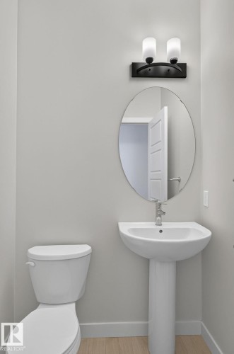 Neutral paint finishes complement the white pedestal sink and toilet - 33 11910 35 Avenue, Edmonton, AB 