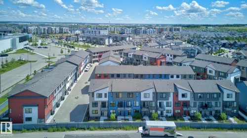 Aerial perspective showcasing a modern residential neighborhood with a variety of housing types - 33 11910 35 Avenue, Edmonton, AB 