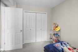 Neutral-toned walls complement the light gray carpeting - 