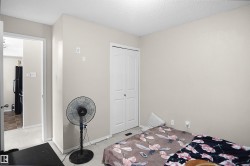 Light beige walls complement neutral carpeting - 