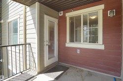 Exterior balcony featuring a concrete floor and black metal railing - 