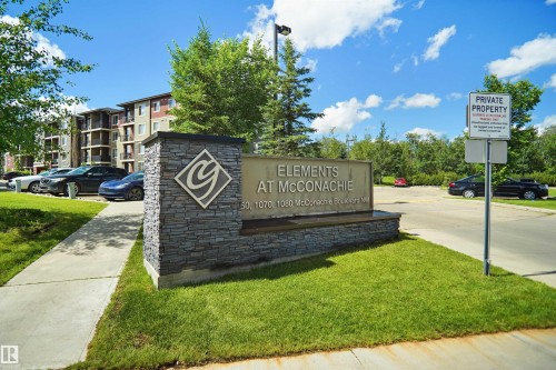 Stone-clad monument sign featuring property branding - 215 1070 Mcconachie Blvd, Edmonton, AB 