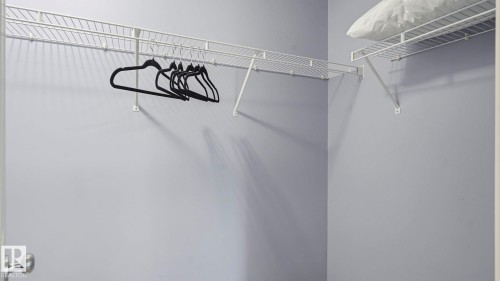 Built-in wire shelving system with white finish, providing ample storage capacity - 3591 Mclean Crescent, Edmonton, AB 
