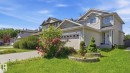 Two-story residence featuring light-colored siding and a contrasting roof - 3591 Mclean Crescent, Edmonton, AB 
