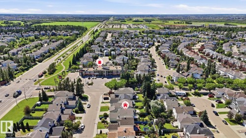 Sprawling residential neighborhood featuring a mix of housing styles, established tree-lined streets, and a commercial center with retail options - 3591 Mclean Crescent, Edmonton, AB 