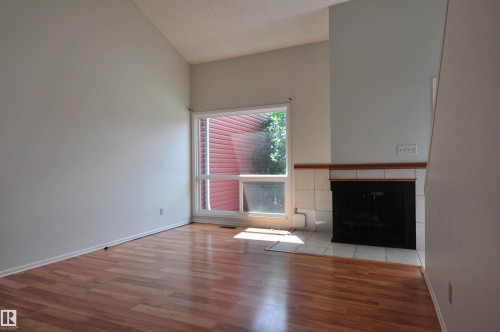 Vaulted ceiling with wood-finish flooring - 617 Millbourne Road E, Edmonton, AB 