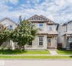 Two-story residence featuring light-toned siding, a prominent front gable, and a covered entry - 636 Mcdonough Link Link, Edmonton, AB 