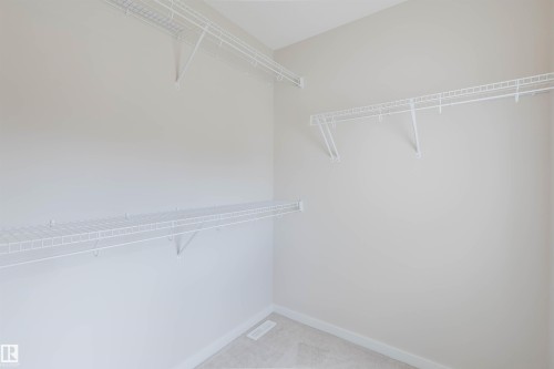 Neutral-toned walls complement the carpeted flooring - 636 Mcdonough Link Link, Edmonton, AB 