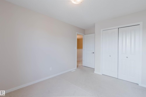 Neutral-toned walls complement plush carpeting throughout - 636 Mcdonough Link Link, Edmonton, AB 