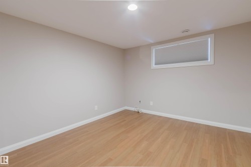 Room featuring light wood-finish flooring, neutral wall paint, and white baseboards - 636 Mcdonough Link Link, Edmonton, AB 