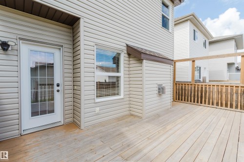 Expansive outdoor deck featuring natural wood decking and railing - 636 Mcdonough Link Link, Edmonton, AB 