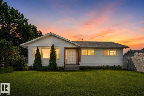 Single-story residence featuring white siding and a prominent front gable - 12238 48 Street, Edmonton, AB 
