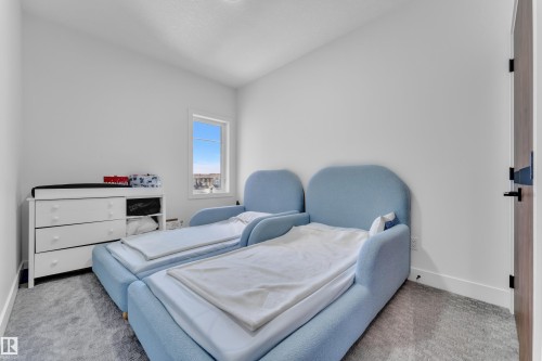 Light-filled interior space featuring a single window and recessed lighting - 16816 49 Street, Edmonton, AB 
