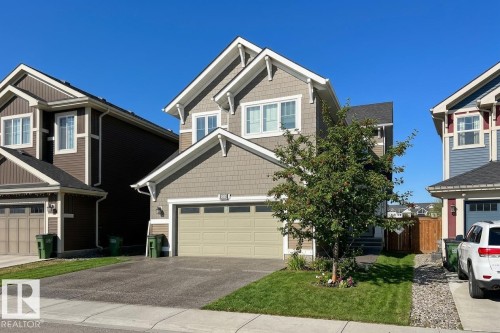 Two-story residence featuring light brown and grey siding with white trim accents - 4343 Crabapple Crescent, Edmonton, AB 