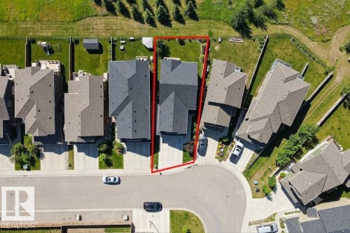 Residential property featuring a rectangular lot, paved driveway, and established landscaping - 4343 Crabapple Crescent, Edmonton, AB 