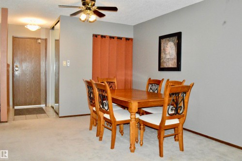 Dining area featuring ceiling fan light fixture - 302 10335 118 Street, Edmonton, AB 