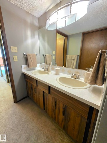 Double vanity with integrated sinks and a white countertop - 302 10335 118 Street, Edmonton, AB 