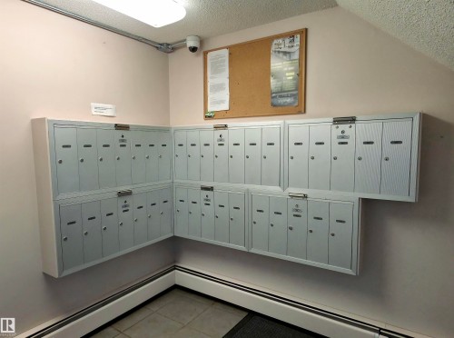 Wall-mounted mailboxes featuring individual compartments - 302 10335 118 Street, Edmonton, AB 