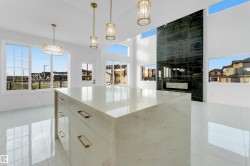 Contemporary kitchen island featuring a light-toned countertop and integrated storage - 