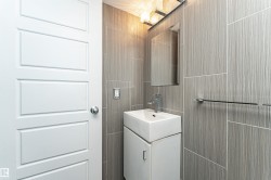 Modern bathroom with large format textured wall tiles - 