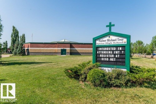 Community school with multi-toned brick exterior and circular architectural elements - 1816 36 Avenue, Edmonton, AB 