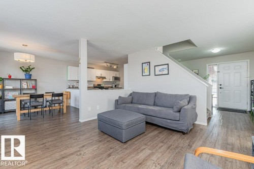 Open-concept living space with wood-finish flooring - 1816 36 Avenue, Edmonton, AB 