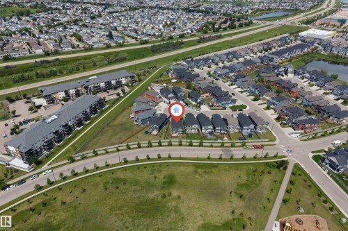 Aerial perspective showcasing a residential area with varied housing types - 715 Ebbers Place Nw, Edmonton, AB 