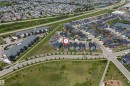 Aerial perspective showcasing a residential area with varied housing types - 715 Ebbers Place Nw, Edmonton, AB 