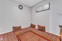 Light gray wall finishes with white baseboards - 