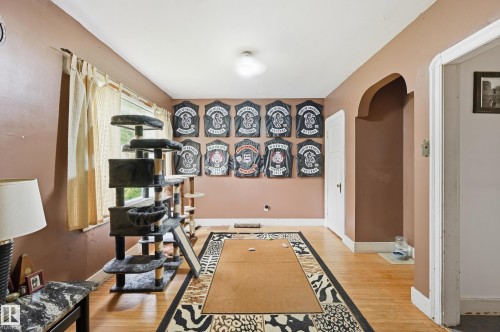 Light wood-finish flooring extending throughout the space - 11325 101 Street, Edmonton, AB 