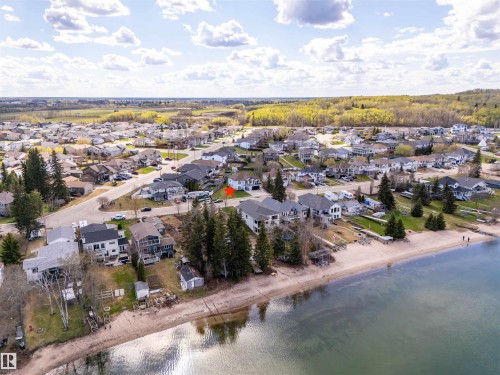 Lakeside community featuring sandy beaches, mature trees, and residential properties - 711 Beach Avenue, Cold Lake, AB - Outdoor With Body Of Water With View