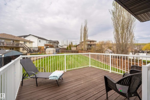 Spacious outdoor deck with dark wood-finish flooring and white perimeter railing - 711 Beach Avenue, Cold Lake, AB - Outdoor With Deck Patio Veranda With Exterior