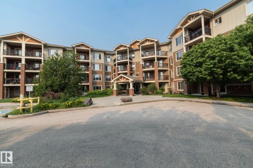 Multi-story residential building featuring a brick and siding exterior - 208 3719 Whitelaw Lane, Edmonton, AB 