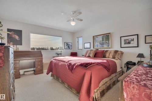 Carpeted bedroom with ceiling fan and a textured ceiling - A49375 Rr 243, Rural Leduc County, AB 