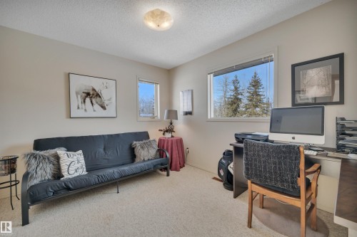 Carpeted home office with a textured ceiling - A49375 Rr 243, Rural Leduc County, AB 
