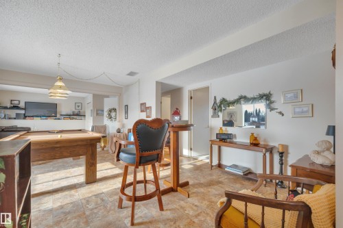 Rec room featuring pool table and a textured ceiling - A49375 Rr 243, Rural Leduc County, AB 
