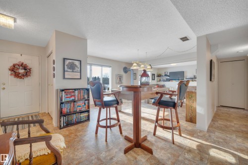 Dining room with a textured ceiling - A49375 Rr 243, Rural Leduc County, AB 