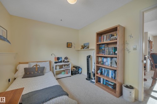 Bedroom with carpet flooring and a textured ceiling - A49375 Rr 243, Rural Leduc County, AB 